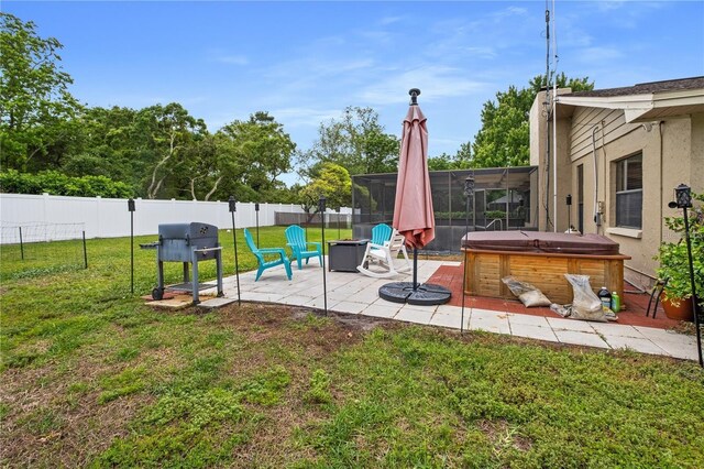 view of yard with an outdoor fire pit, a hot tub, and a patio area