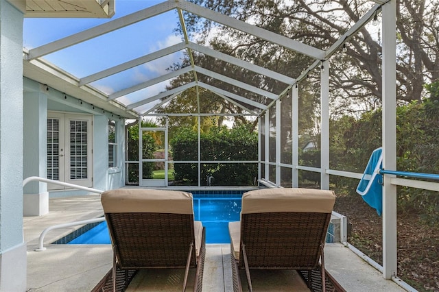 sunroom with a swimming pool and lofted ceiling