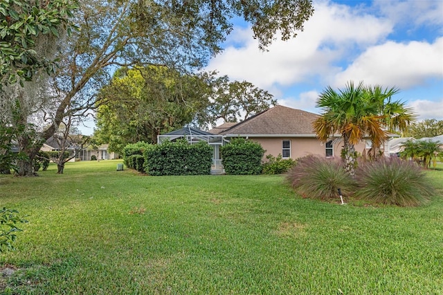 view of yard featuring a lanai