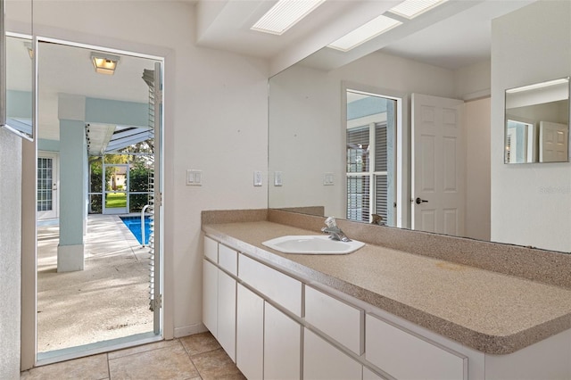 bathroom featuring tile patterned flooring and vanity