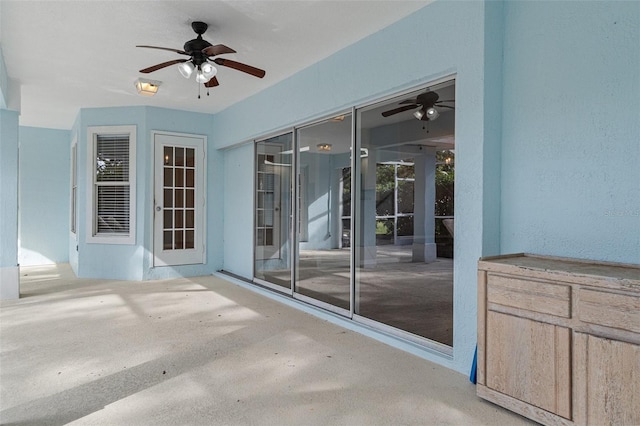 view of patio featuring ceiling fan