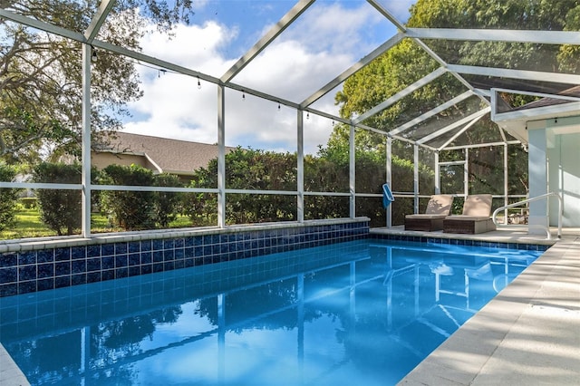 view of pool featuring a lanai