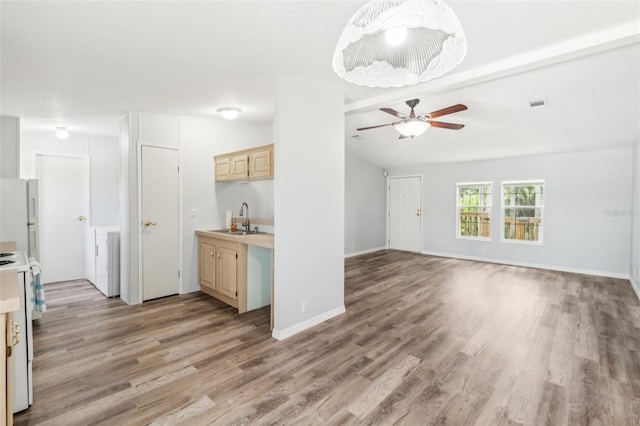 14904 Old Dixie Hwy, Hudson, FL 34667 - kitchen with lofted ceiling with beams, light countertops, white appliances, a ceiling fan, and a sink