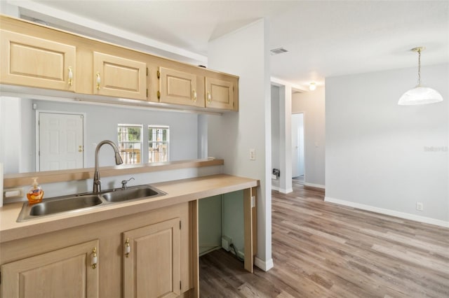 14904 Old Dixie Hwy, Hudson, FL 34667 - kitchen with light brown cabinetry, visible vents, and a sink