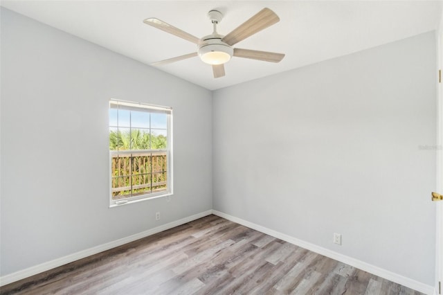 14904 Old Dixie Hwy, Hudson, FL 34667 - unfurnished room featuring baseboards, wood finished floors, and ceiling fan