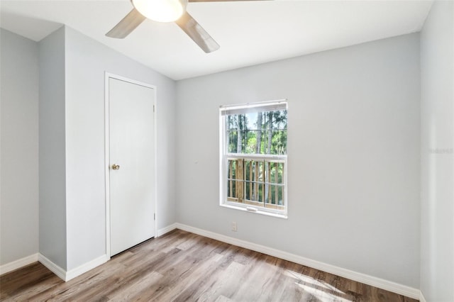14904 Old Dixie Hwy, Hudson, FL 34667 - unfurnished room with baseboards, light wood-style floors, and ceiling fan