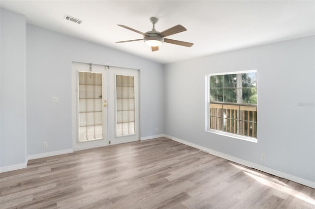 14904 Old Dixie Hwy, Hudson, FL 34667 - unfurnished room with french doors, wood finished floors, baseboards, visible vents, and ceiling fan