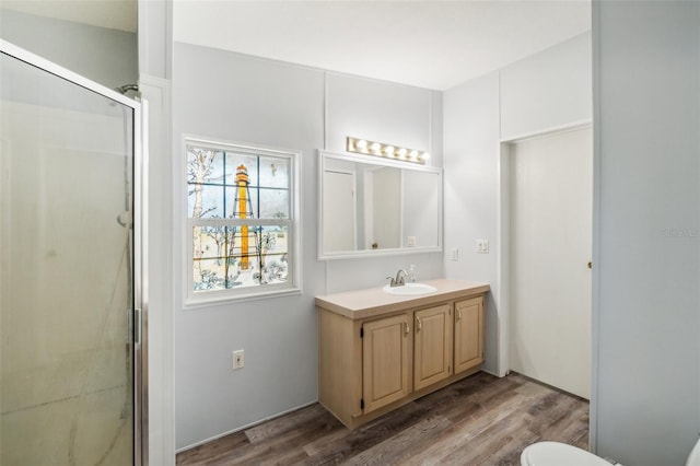 14904 Old Dixie Hwy, Hudson, FL 34667 - bathroom with vanity, wood finished floors, toilet, and a shower stall