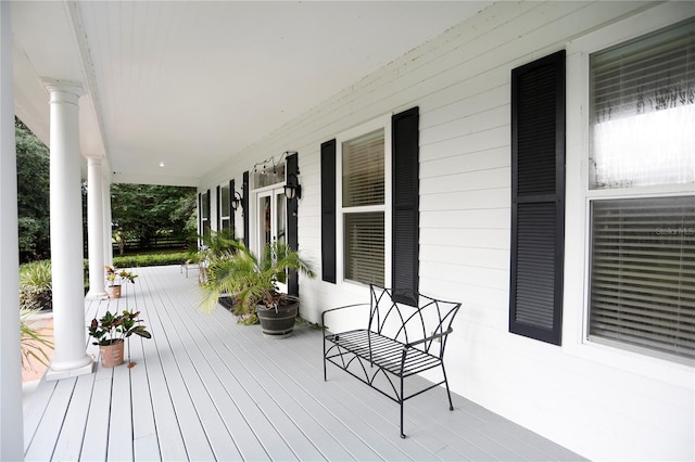 wooden deck featuring covered porch