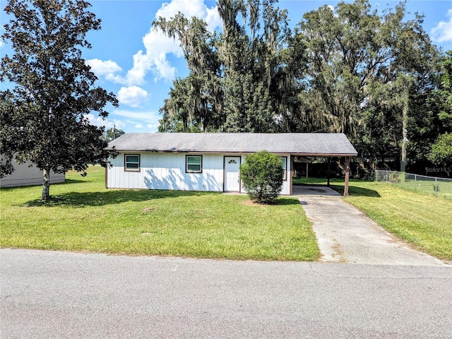 single story home with a front yard and a carport