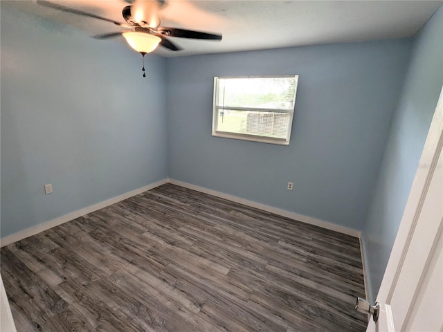 unfurnished room with ceiling fan and dark hardwood / wood-style floors