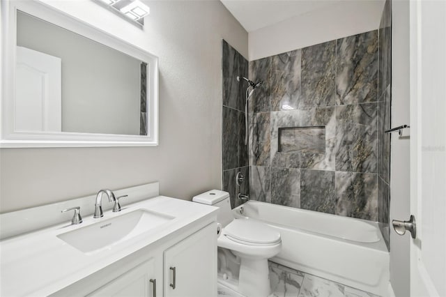 bathroom featuring vanity, toilet, tub / shower combination, and marble finish floor