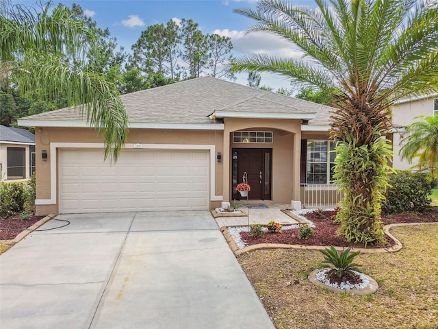 single story home with stucco siding, driveway, a shingled roof, and a garage