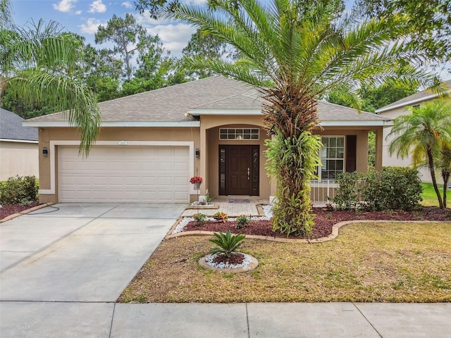 ranch-style home with stucco siding, a garage, driveway, and a shingled roof