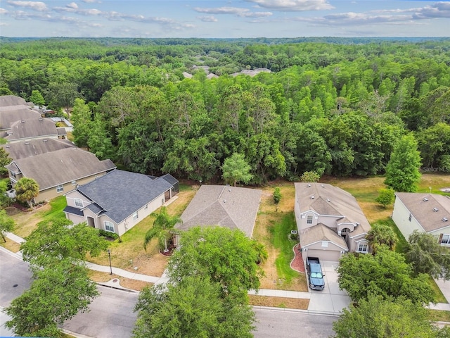 bird's eye view featuring a residential view and a view of trees