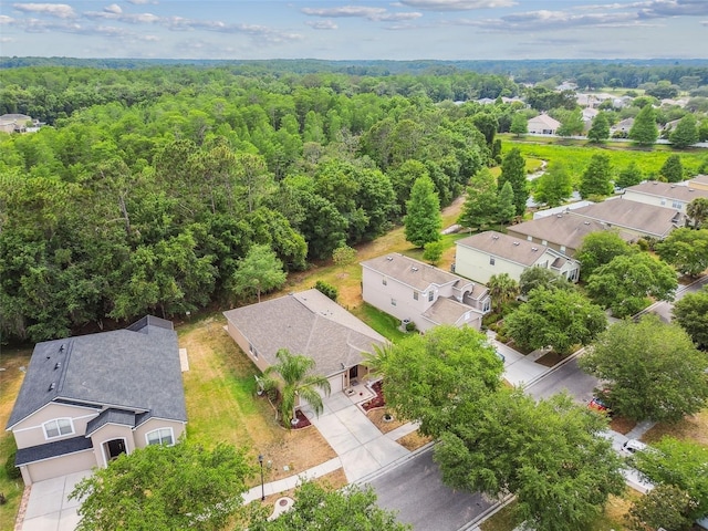 aerial view with a residential view and a wooded view