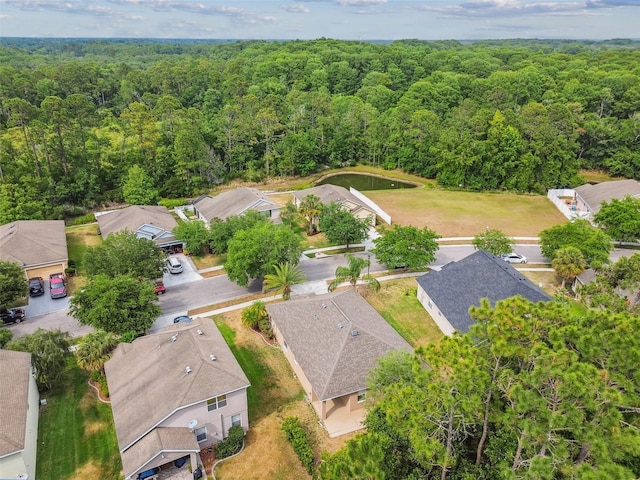 aerial view featuring a residential view and a view of trees