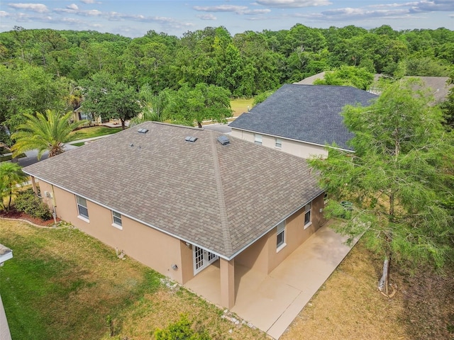 drone / aerial view with a forest view