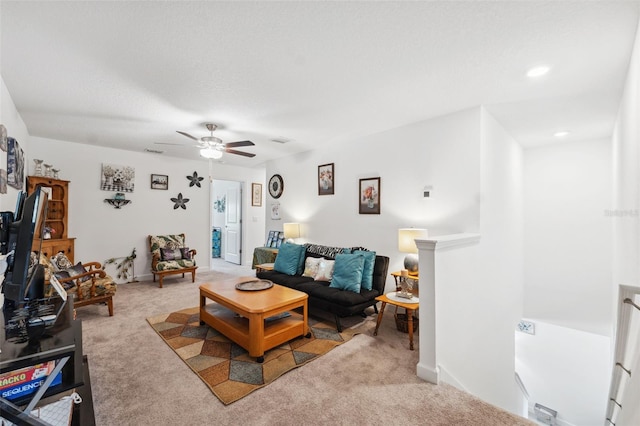 living room with ceiling fan and carpet floors