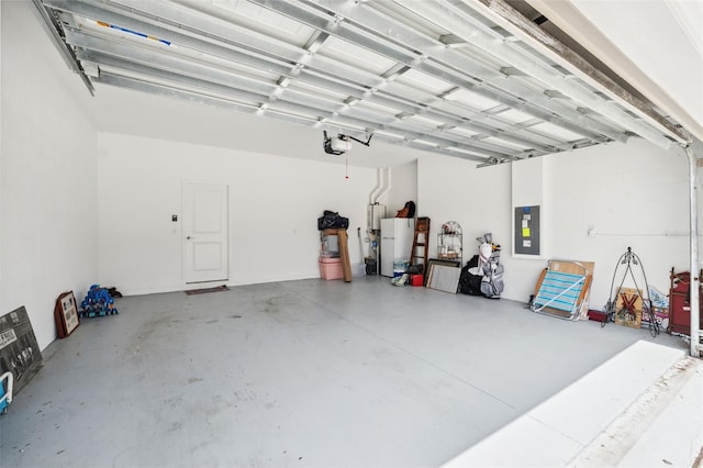 garage featuring a garage door opener, electric panel, and white fridge