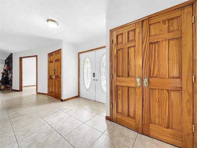 entrance foyer with light tile patterned flooring