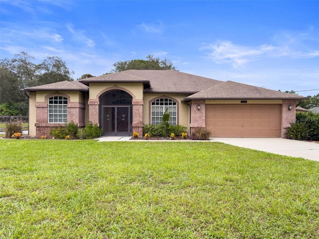 view of front of house featuring a front yard and a garage