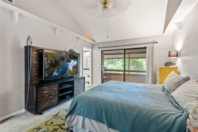 carpeted bedroom featuring vaulted ceiling, a textured ceiling, access to exterior, and ceiling fan