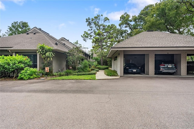 view of property exterior with roof with shingles