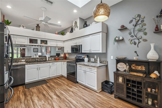 kitchen featuring white cabinets, ceiling fan, stainless steel appliances, and sink