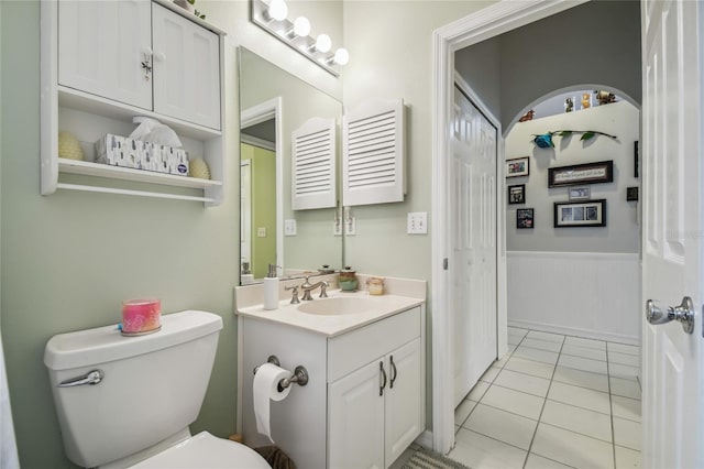 bathroom featuring tile patterned floors, toilet, and vanity