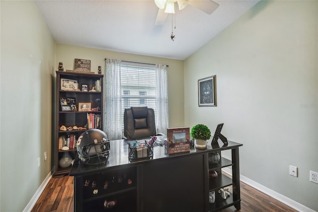 home office with lofted ceiling, ceiling fan, and dark hardwood / wood-style floors