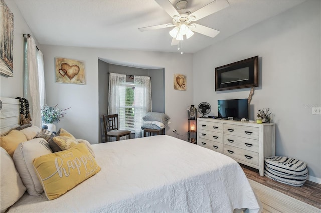 bedroom with light wood-type flooring, lofted ceiling, and ceiling fan