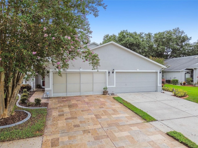 view of front of property with a garage