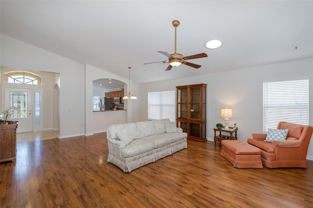 living room featuring hardwood / wood-style flooring, lofted ceiling, and plenty of natural light