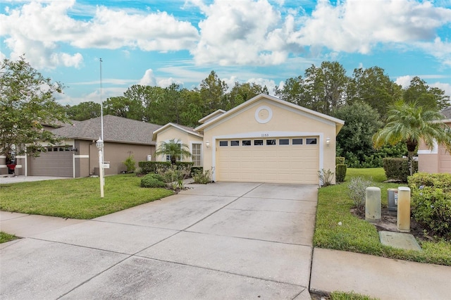 ranch-style house featuring a front lawn, concrete driveway, a garage, and stucco siding