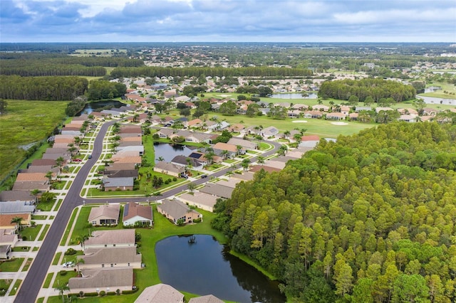 birds eye view of property with a residential view and a water view