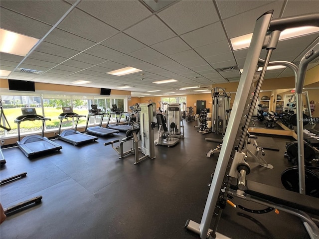 workout area featuring a paneled ceiling