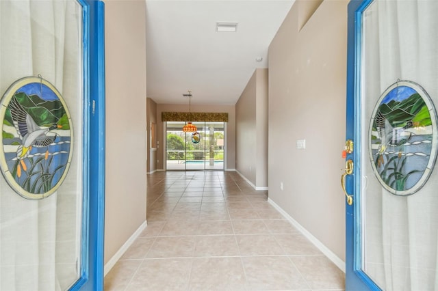 hallway with light tile patterned floors