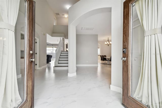 entrance foyer with a notable chandelier