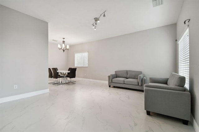 living room featuring a notable chandelier