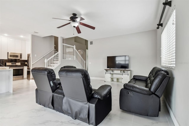 living room with ceiling fan