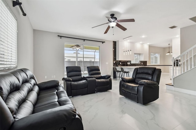 living room featuring ceiling fan