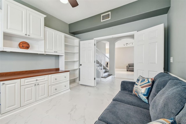 living room featuring ceiling fan