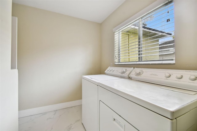 washroom with washing machine and clothes dryer