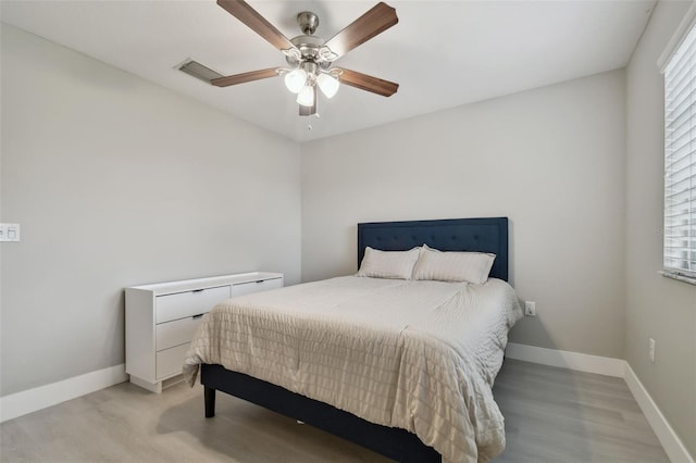 bedroom featuring ceiling fan and light hardwood / wood-style flooring