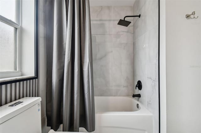 bathroom featuring shower / bath combo with shower curtain