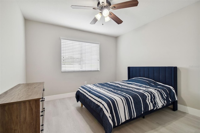 bedroom featuring ceiling fan and light hardwood / wood-style flooring