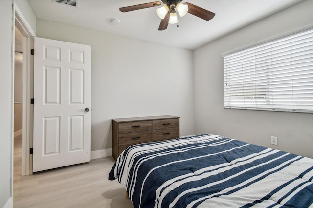 bedroom with ceiling fan and light hardwood / wood-style flooring