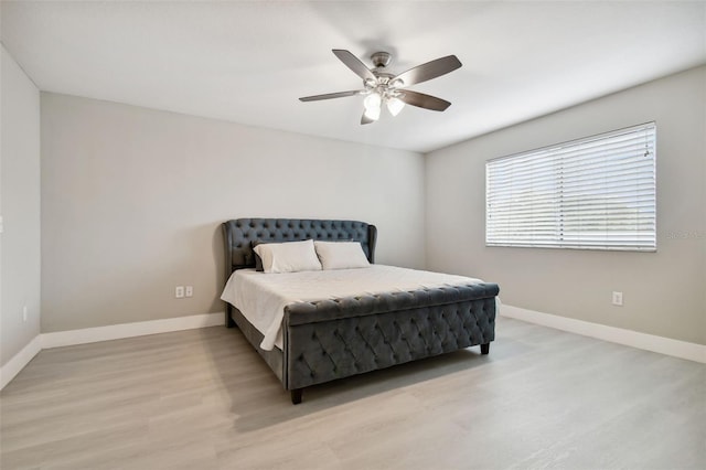 bedroom featuring ceiling fan and light wood-type flooring