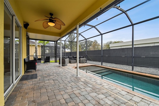 exterior space with ceiling fan, a lanai, a fenced in pool, and an outdoor hangout area